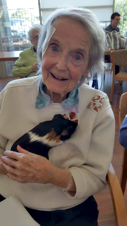 Pam holding a guinea pig from petting farm