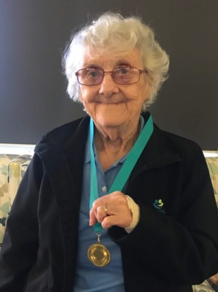 Cranbourne resident proudly shows gold medal