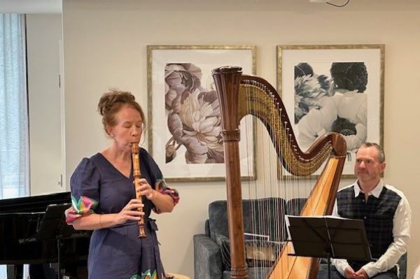 Marshall McGuire and Genevieve Lacey performing for residents at Regis Camberwell