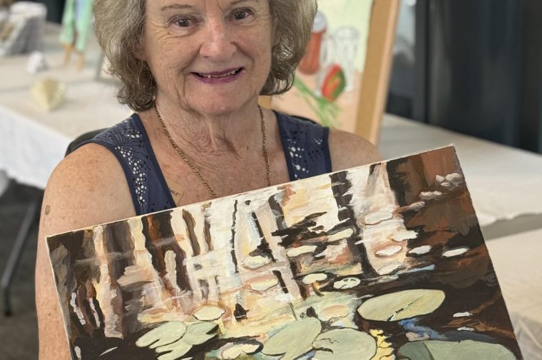 Sandra Williams with her artwork, "Untitled"