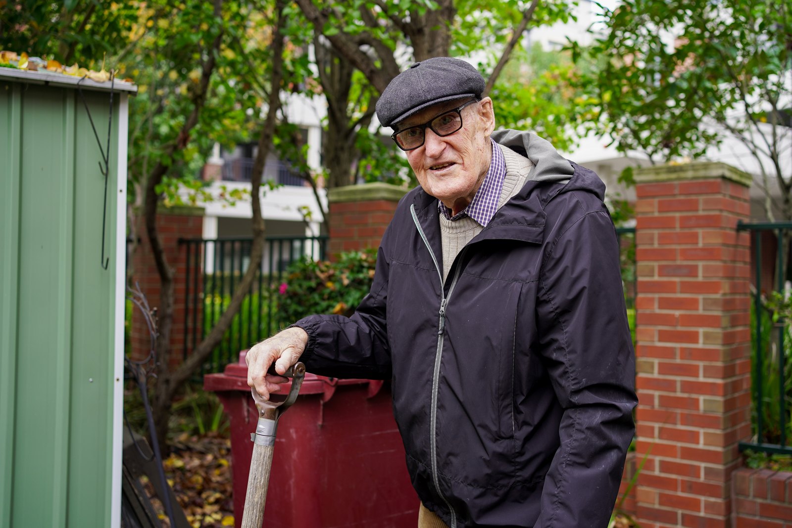 Regis client tending his garden at home